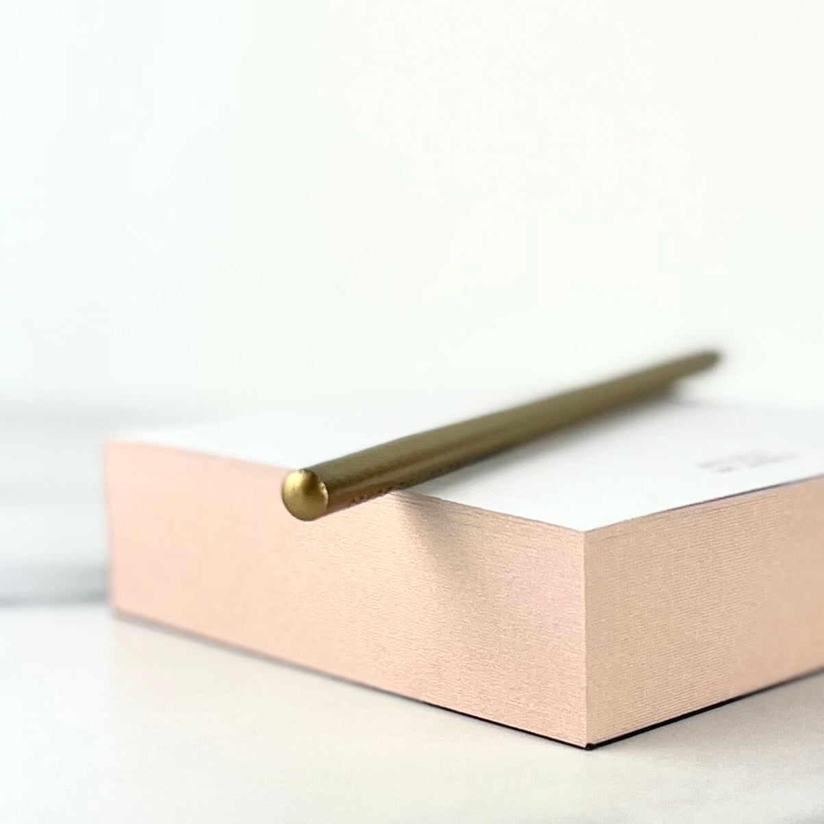 Small Blush-Edged Notepad shown from the side to reveal its blush-pink colored-edges - The Offbeat Co.