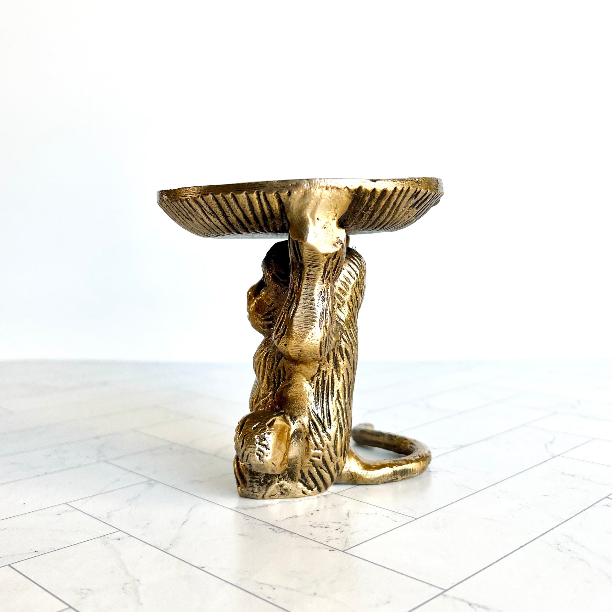 The brass animal figurine shown from the side