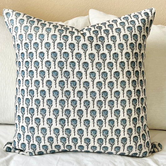 The Blue Flowers Block Print Pillow Cover against other white pillows - The Offbeat Co.
