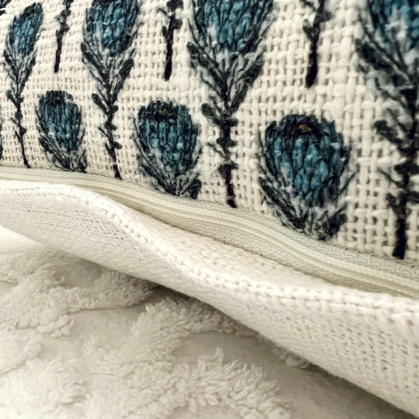 A close up of the invisible zipper closure on the Blue Flowers Block Print Pillow Cover - The Offbeat Co.